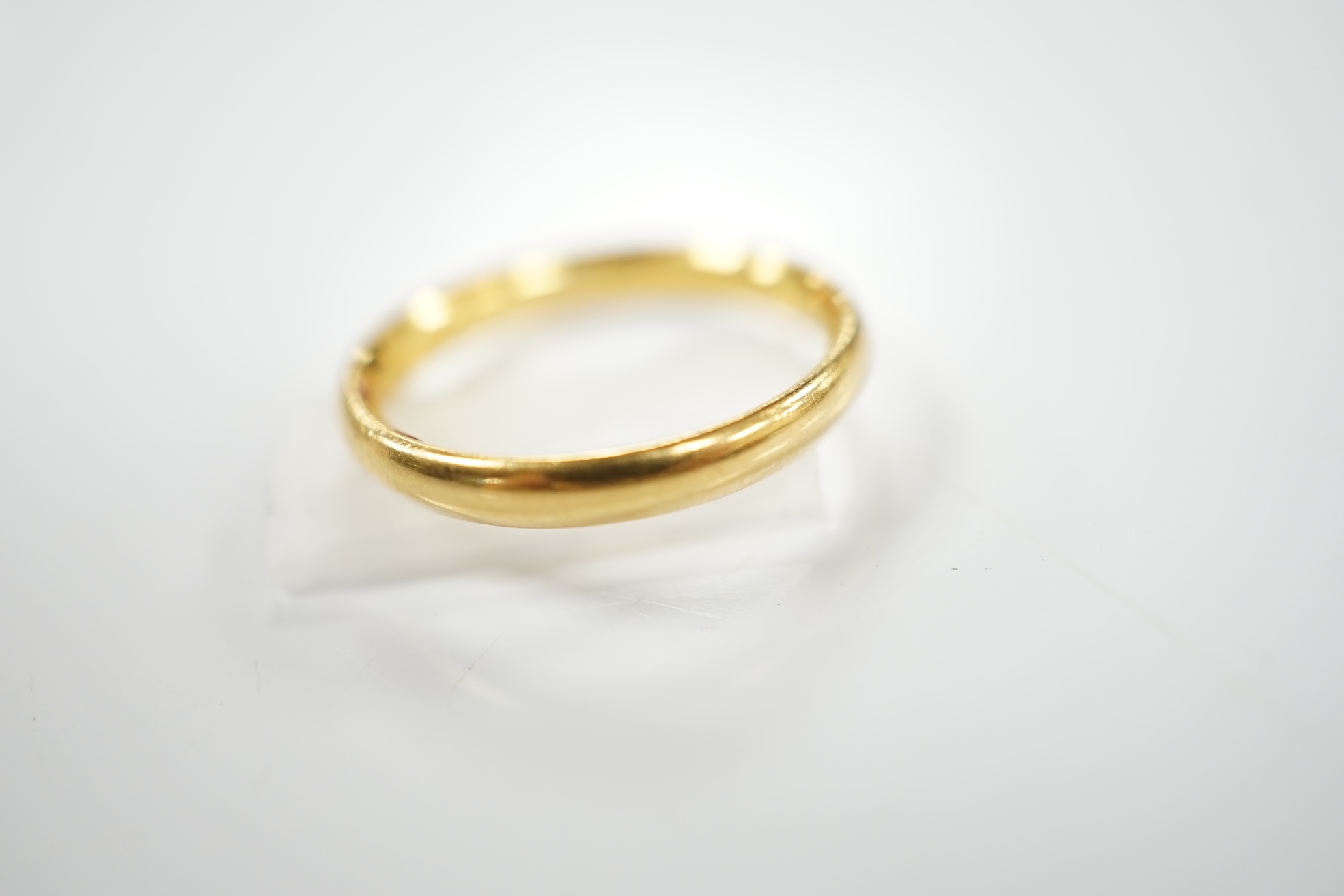 A 22ct gold wedding band, size J, 3.3 grams, Condition - good